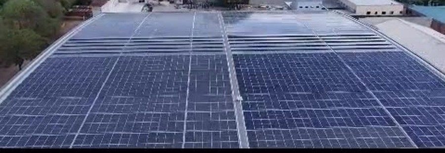 Rooftop photovoltaic array covering the entire factory roof